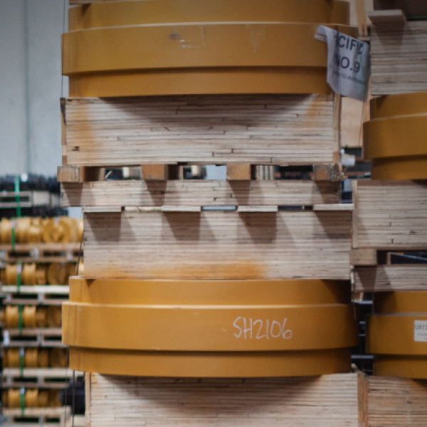 yellow idlers on pallets near track rollers Adelaide